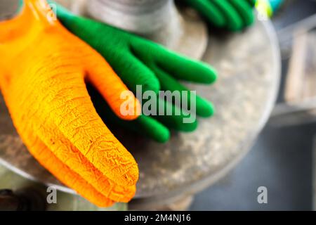 fisherman wearing waterproof clothes and gloves on a fishing boat in australia on a boat Stock Photo