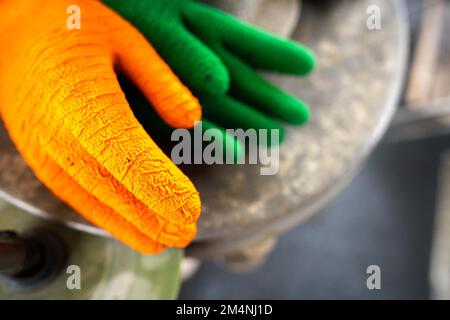 fisherman wearing waterproof clothes and gloves on a fishing boat in australia on a boat Stock Photo