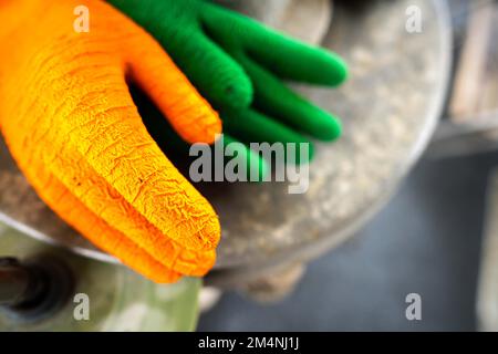 fisherman wearing waterproof clothes and gloves on a fishing boat in australia on a boat Stock Photo