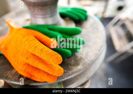 fisherman wearing waterproof clothes and gloves on a fishing boat in australia on a boat Stock Photo