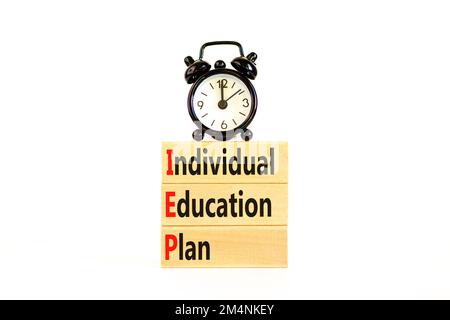 IEP individual education plan symbol. Concept words IEP individual education plan on wooden blocks on beautiful white table white background. Business Stock Photo