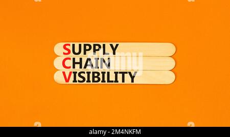 SCV supply chain visibility symbol. Concept words SCV supply chain visibility on wooden sticks on beautiful orange table orange background. Business S Stock Photo