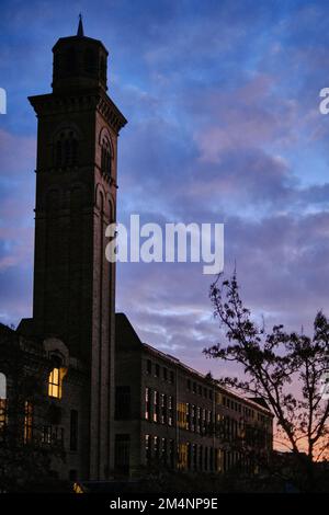 New mills building, part of Salts Mills in Saltaire, Shipley near Bradford, West Yorkshire at sunrise. Part of the iconic Saltaire Village Stock Photo