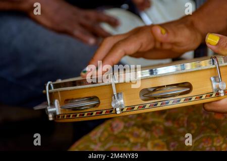 Tambourine being played by a ritimist during a samba performance in brazilian carnival in Salvador city, Bahia, Brazil Stock Photo