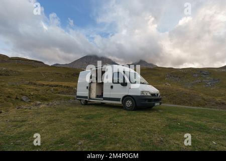 Beautiful mountain landscape near Gavarnie with camper van on meadow at Col de Tentes in the Pyrenees with peak of Taillon, Nouvelle-Aquitaine, France Stock Photo