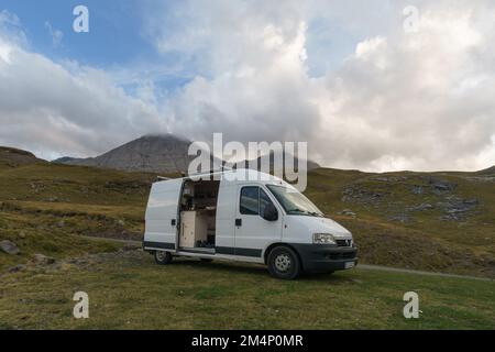 Beautiful mountain landscape near Gavarnie with camper van on meadow at Col de Tentes in the Pyrenees with peak of Taillon, Nouvelle-Aquitaine, France Stock Photo