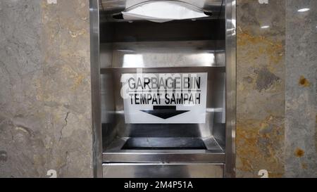 Modern stainless steel trash can attached to the wall Stock Photo