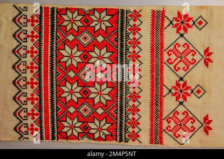 Detail Ukrainian ethnic ornament towel, embroidered good by cross-stitch pattern, close up Stock Photo