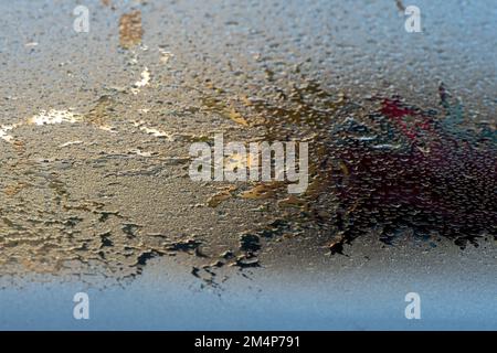 Frozen car windscreen close up view from the inside looking out defrosting under car heaters. Stock Photo