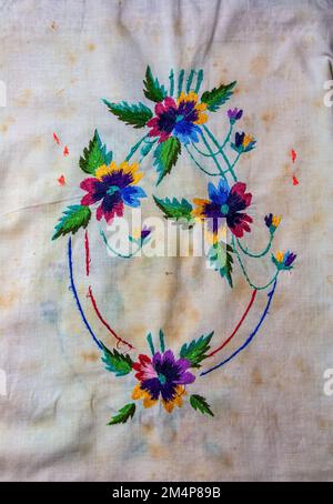 Towel with Ukrainian ethnic ornament, well embroidered with satin stitch, close-up Stock Photo