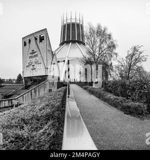 The Liverpool Metropolitan Cathedral pictured at the end of a pathway and wet railing pictured in December 2022. Stock Photo