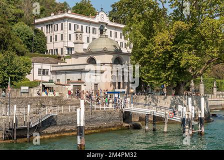 Tremezzina, Lombardy, Italy - September 5, 2022: The pier of the Villa Carlotta in Tremezzina village with tourists are waiting for the ferry boat for Stock Photo
