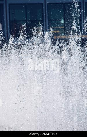 A water fountain sprinkling water in the view Stock Photo