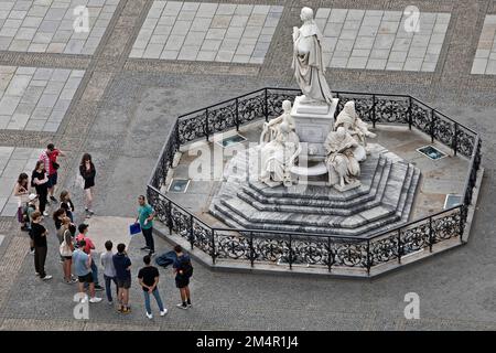 Teacher with group of pupils in front of the Schiller Monument on the Gendarmenmarkt, Berlin, Germany Stock Photo