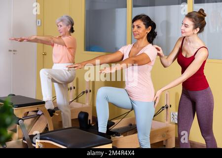 Combo Wunda Pilates Chair Woman Instructor Fitness Yoga Gym Exercise Copy  Space Sports Banner Stock Photo - Download Image Now - iStock
