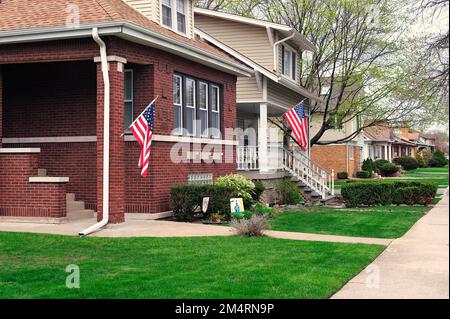 Chicago, Illinois, USA. Bungalow-styled homes, some sporting a patriotic look with American flags, typical to the city's Edison Park neighborhood. Stock Photo