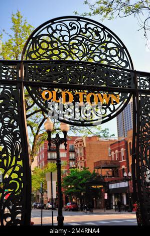 Chicago, Illinois, USA. An entry gate along a sidewalk on Wells Street serves to identify Chicago's Old Town neighborhood. Stock Photo