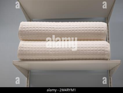 Two ergonomic pillows on the shelf. Orthopedic Pillow with a Memory Effect. Medical treatment pillow for sleep. Sleeping Support Pillow. Nobody Stock Photo