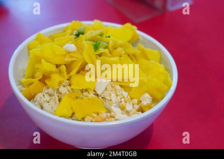 Boiled rice or porridge with minced chicken and crispy toppings Stock Photo