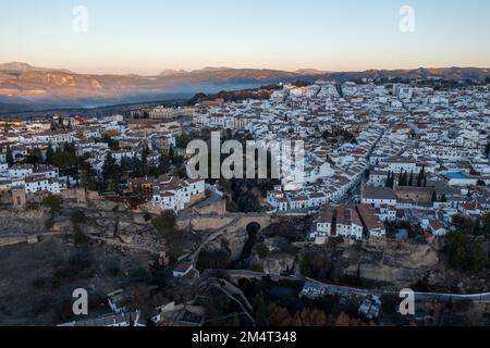 Rocky landscape of Ronda city with Puente Nuevo Bridge and buildings, Andalusia, Spain Stock Photo