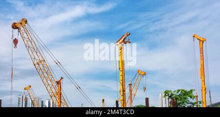 Panorama view of construction sites and many cranes are working in the Industry new building. Stock Photo