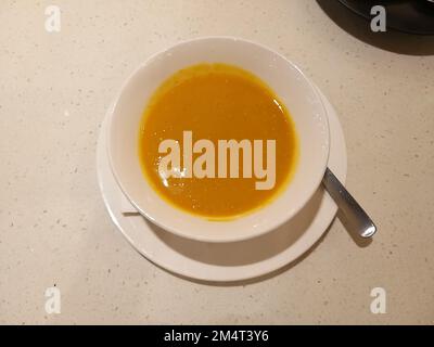 A Vibrant Pumpkin Creamy Soup Stock Photo