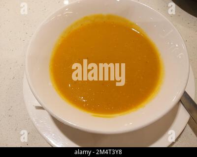 A Vibrant Pumpkin Creamy Soup Stock Photo
