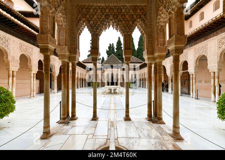 Granada, Spain - Nov 29, 2021: Courtyard of the Lions in the Alhambra palace - masterpiece of moorish architecture (14th century). Stock Photo