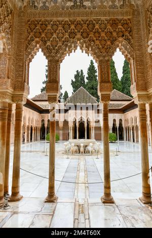 Granada, Spain - Nov 29, 2021: Courtyard of the Lions in the Alhambra palace - masterpiece of moorish architecture (14th century). Stock Photo