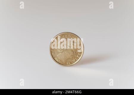 New Zealand dollar copin/s with the iconic Kiwi bird on one side and the head of the late Queen Elizabeth II, who was until her death the head of stat Stock Photo