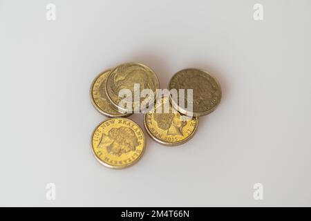 New Zealand dollar copin/s with the iconic Kiwi bird on one side and the head of the late Queen Elizabeth II, who was until her death the head of stat Stock Photo