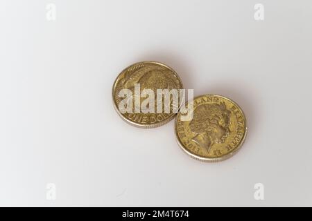 New Zealand dollar copin/s with the iconic Kiwi bird on one side and the head of the late Queen Elizabeth II, who was until her death the head of stat Stock Photo