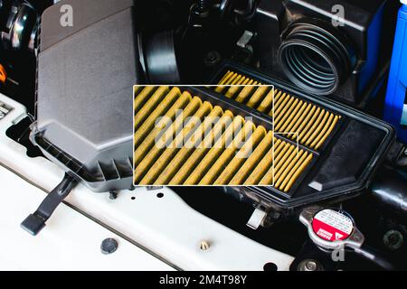 A close up of an automobile air filter is displayed in a frame, Air filtration of the air intake system in the ignition, automotive part concept Stock Photo