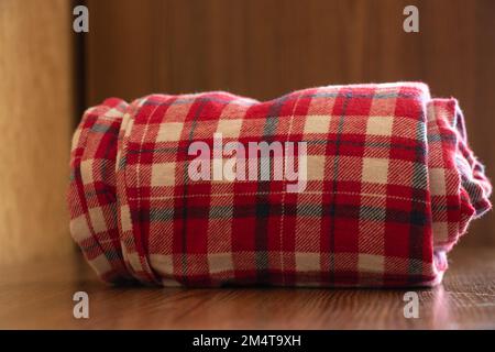 twisted home pants in a cage on the shelves Stock Photo