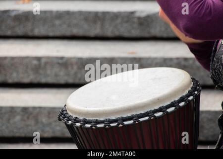 playing the drum with hands close-up, musical instrument Stock Photo