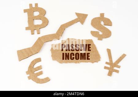 Economic concept. On a white background, symbols of bitcoin, dollar, euro, yen, an upward arrow and a torn cardboard with the inscription - Passive in Stock Photo