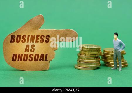 Business and economy concept. On the green surface of the coin and a figure of a man, they are indicated by a sign - a hand with the inscription - Bus Stock Photo