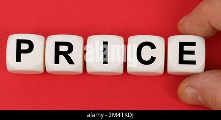 Business and finance. On the red surface, white cubes with the inscription - PRICE Stock Photo