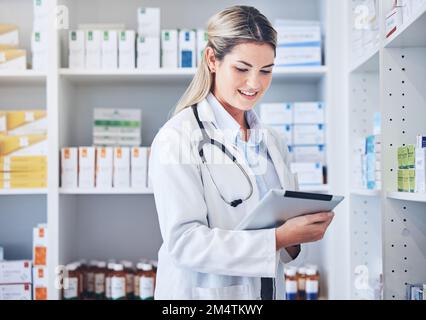 Pharmacy, tablet and pharmacist with checklist, research or online prescription in drug store. Medicine, medical and woman with medication inventory Stock Photo