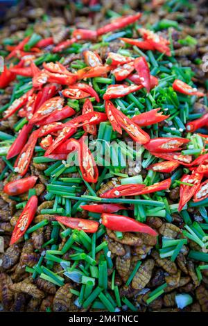 Fried bugs and insects are a common street food snack in Thailand and Cambodia. Stock Photo