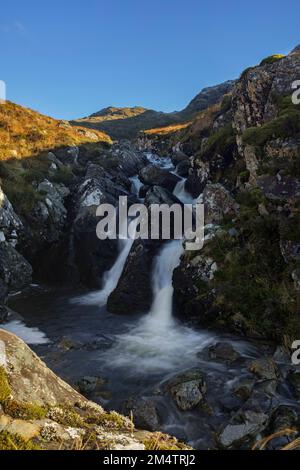 The waters of Allt a' Choire Mhoir, in the hills above Loch Long. Stock Photo