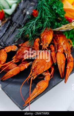 Cancers and vegetables decorated on the table, buffet, banquet Stock Photo
