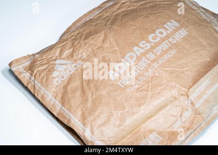 Adidas recyclable package on white background. Stock Photo