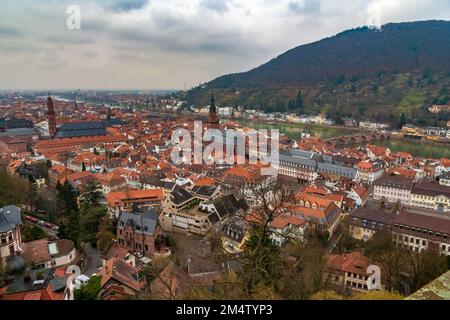 View of Heidelberg, Germany with Neckar river, the bridge Alte Brücke and the hill Heiligenberg in the background. The two churches Jesuitenkirche and... Stock Photo