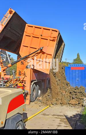 Suction excavator machine on hgv lorry truck creates gas main pits in image 2M4W1F6 and fills with earth spoil which needs tipping out for removal UK Stock Photo