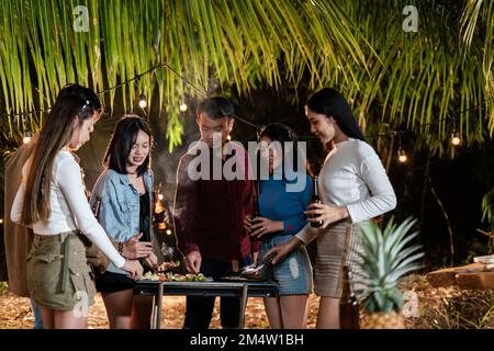 Friends having fun in nature having a barbecue Stock Photo