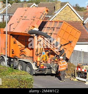 Hiring suction excavator machine on hgv lorry truck for gas main pits in image 2M4W1F6 fills with earth spoil which needs tipping out for removal UK Stock Photo
