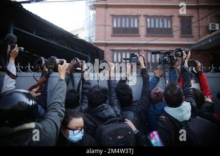 Kathmandu, Nepal. 23rd Dec, 2022. Photo journalists of various media houses try to capture picture of French serial killer Charles Sobhraj, popularly known as ''˜Bikini Killer' after he was released from central jail in Kathmandu and brought to Immigration Office in Dillibazar, Kathmandu on Friday. Credit: ZUMA Press, Inc./Alamy Live News Stock Photo