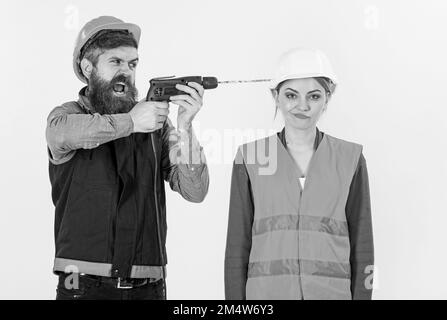Annoying repair concept. Man with drill drills head of woman, Stock Photo