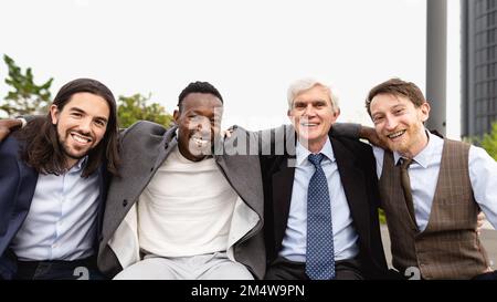 Team of multiracial business people with different ages and ethnicities standing in the city center during meeting work Stock Photo